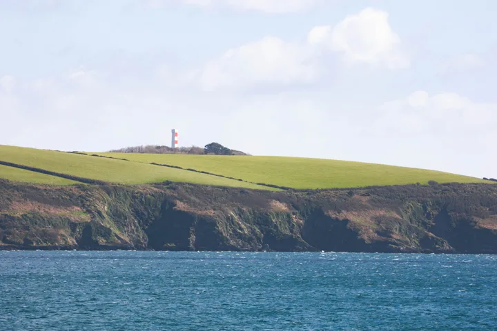 Headland across the water — photograph by Monty Bray