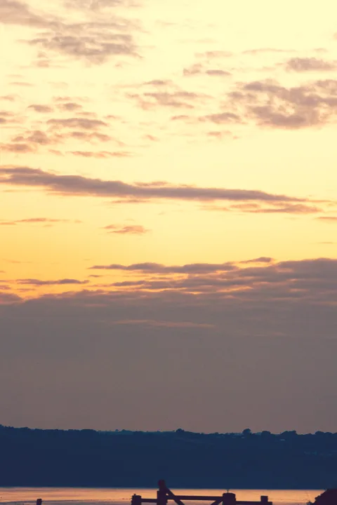 Amber light above the horizon — photograph by Monty Bray