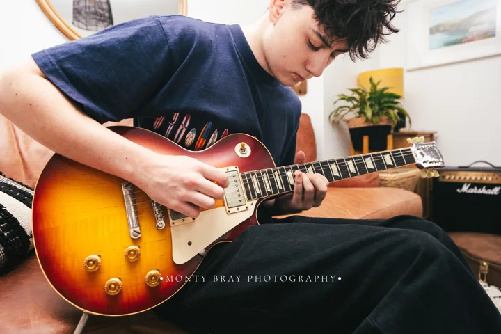 Guitarist at home — photograph by Monty Bray