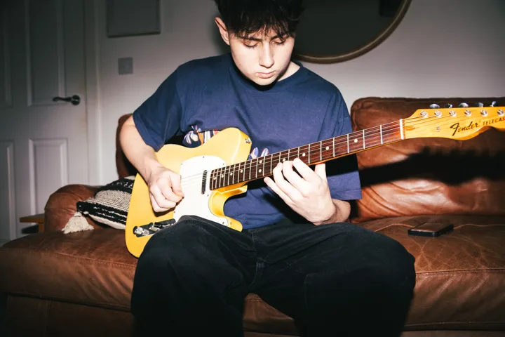 Guitarist at home — photograph by Monty Bray