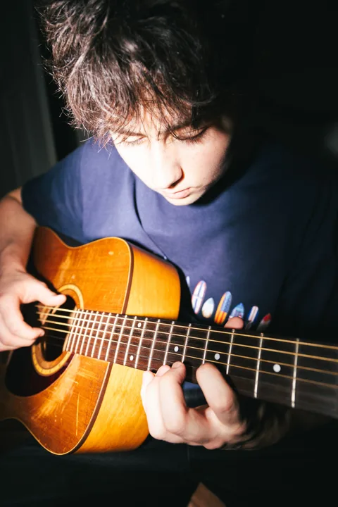 Guitarist at home — photograph by Monty Bray