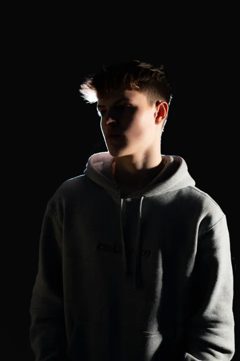 Low-key hoodie portraits — photograph by Monty Bray