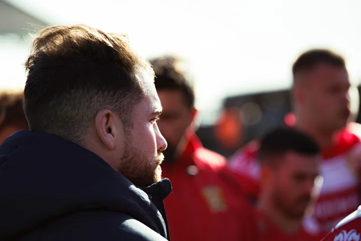Touchline and player details — photograph by Monty Bray
