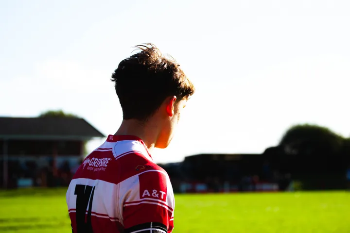 Touchline and player details — photograph by Monty Bray