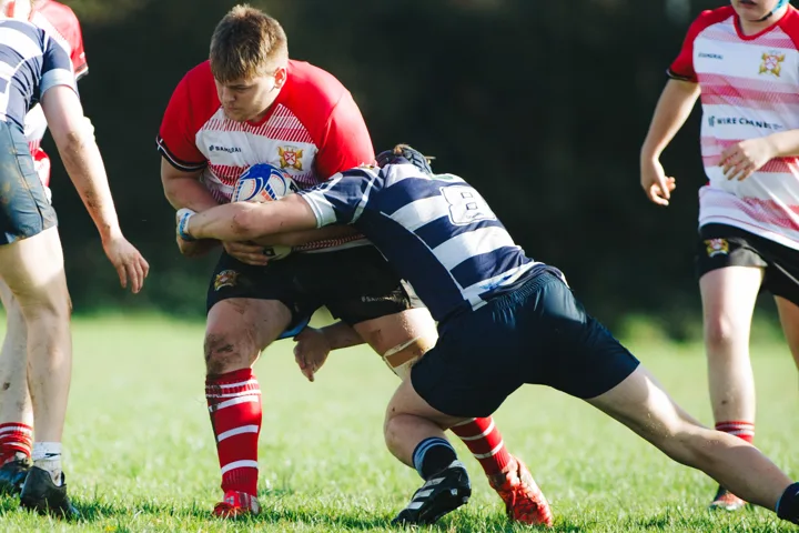 Blue-shirt opposition, close action — photograph by Monty Bray