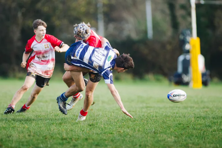 Blue-shirt opposition, close action — photograph by Monty Bray